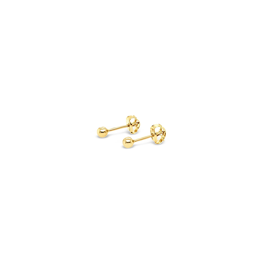 Aros esferas de oro bebe recién nacido.